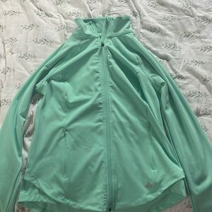 A jacket. It’s a tealish green color. Never been worn. Size medium